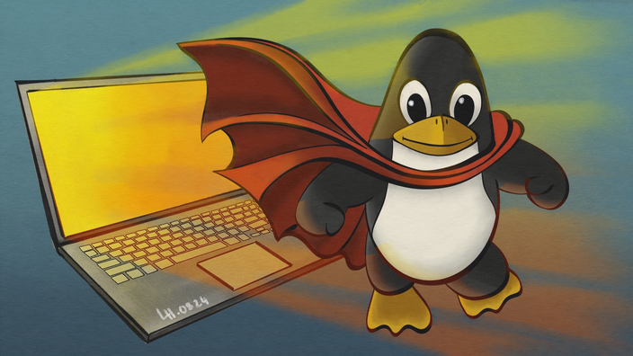 Ein kleiner Pinguin vor einem erleuchteten Laptop