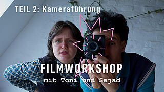 Foto von 2 Personen mit Kamera in der Hand