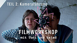 Foto von 2 Personen mit Kamera in der Hand