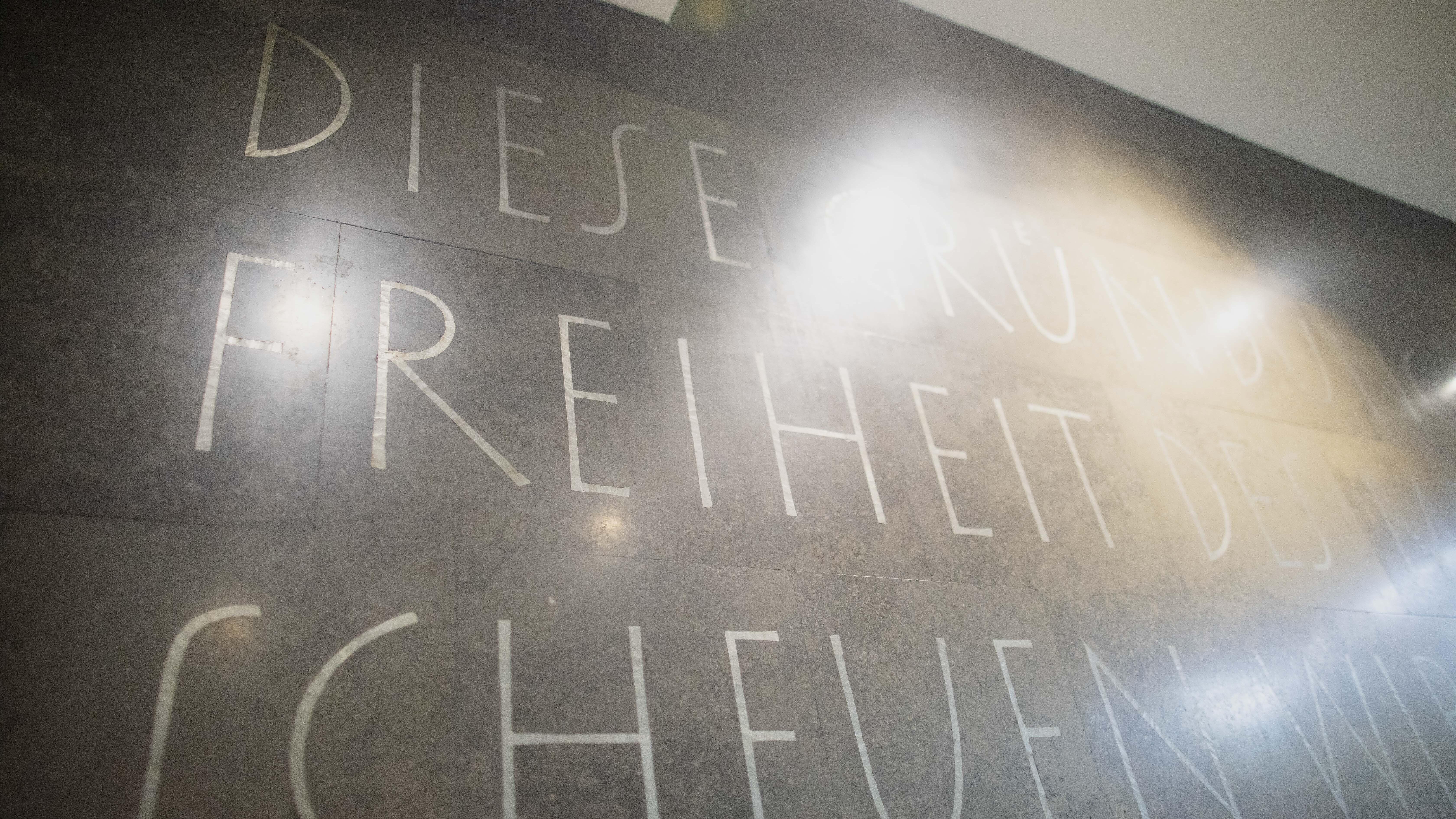Photo of the lettering in the foyer of the AGB - the word freedom can be read
